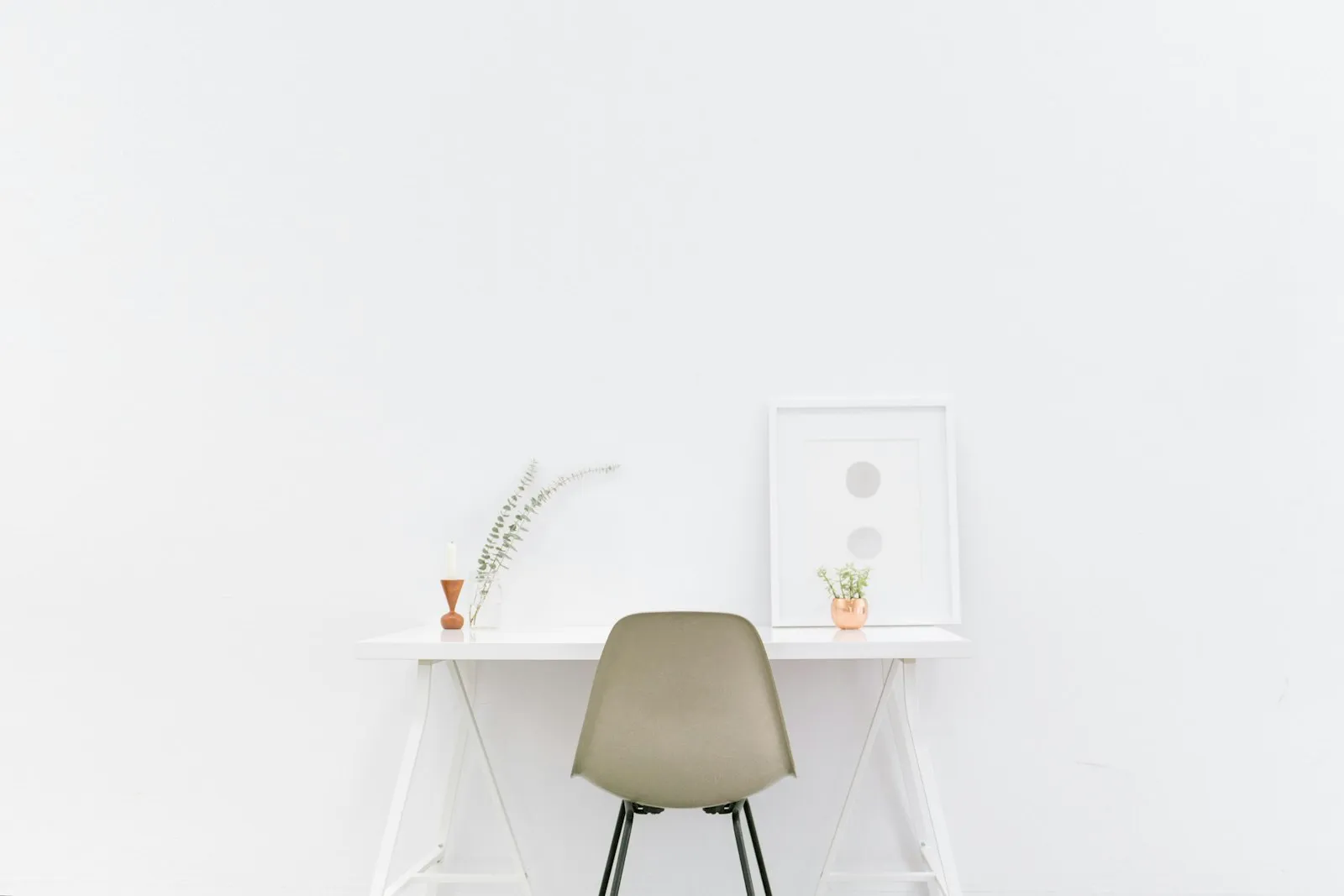 A minimal white desk and chair